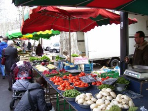 Colorful outdoor markets along the Saone River are exciting to visit.