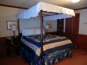 When we at last arrive at the Green Mountain Inn in Stowe, Vermont, this four-poster bed looks good to us