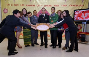 A commemorative photo was taken with dignitaries holding a huge bamboo sieve bountifully filled with freshly handmade Chinese rice balls symbolizing unity and fulfillment and wishing for a joyous and smooth-sailing year! 