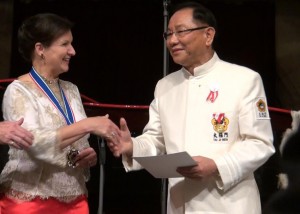 HIRH Herta Margarete Habsburg-Lothringen, president of the Flame of Peace, awards Dr. Hong, Tao-Tze, president of FOWPAL and Zhang-men-ren of Tai Ji Men, the “Medal of Merit in Gold” for his leading FOWPAL members to promote love and peace across the planet.