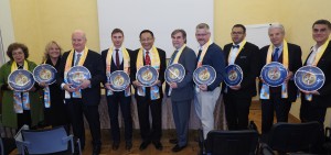 Dr. Hong, Tao-Tze, President of the Federation of World Peace and Love (FOWPAL) and the recipient of  FIRMA (International Festival of Religions, Music, and Arts) Global Peace Award, fifth from left, presents each of the visionaries with a clock, which is a compass of conscience,  symbolizing that all are encouraged to follow the guidance of their conscience at all times, May 13, 2019 in Turin, Italy.