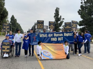 Parade participants from Youth for Human Rights show support for the International Day of Conscience during the celebration of Dr. Martin Luther King Jr.'s birthday in Los Angeles on Jan. 20, 2020.
