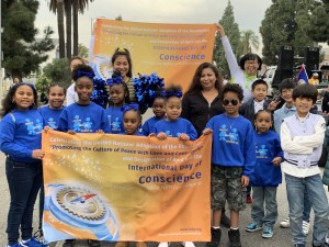Parade participants from Creative Learning Academy show support for the International Day of Conscience during the celebration of Dr. Martin Luther King Jr.'s birthday in Los Angeles on Jan. 20, 2020.