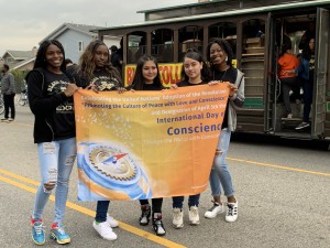 Parade participants from Black College Expo show support for the International Day of Conscience during the celebration of Dr. Martin Luther King Jr.'s birthday in Los Angeles on Jan. 20, 2020.