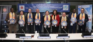 Dr. Hong, Tao-Tze, president of FOWPAL, presents the compass clock of conscience, celebrating the United Nations' designation of April 5 as the International Day of Conscience, to a group of visionary leaders at the UN in New York. (AP Images)