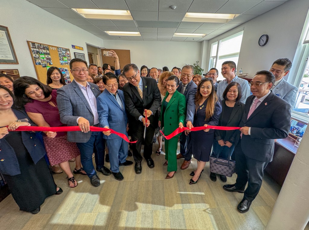 Assemblymember Mike Fong cutting the ribbon alongside local elected officials.